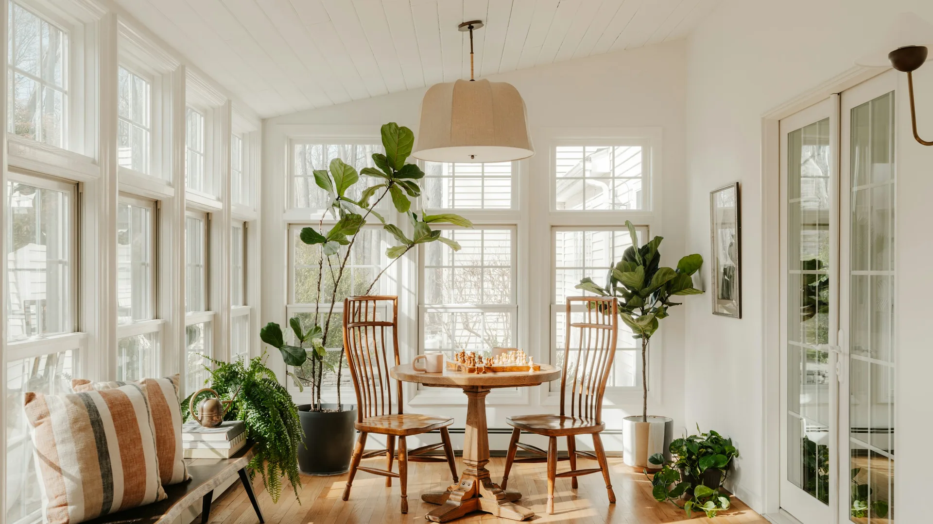Sunroom addition with large windows